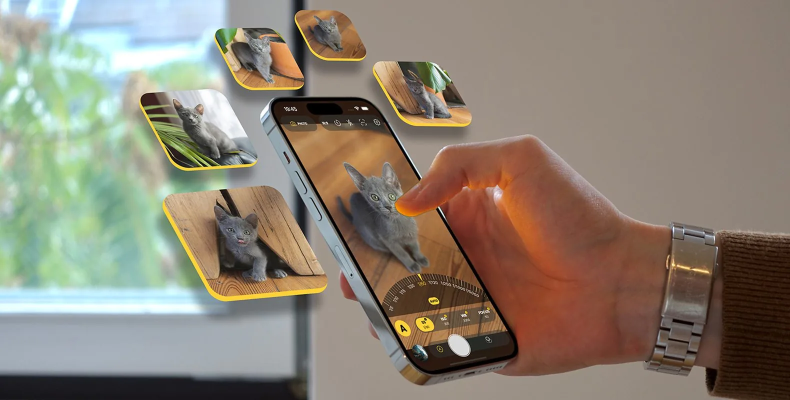 Hand holding an iPhone running Snap Pro Camera with manual control options
